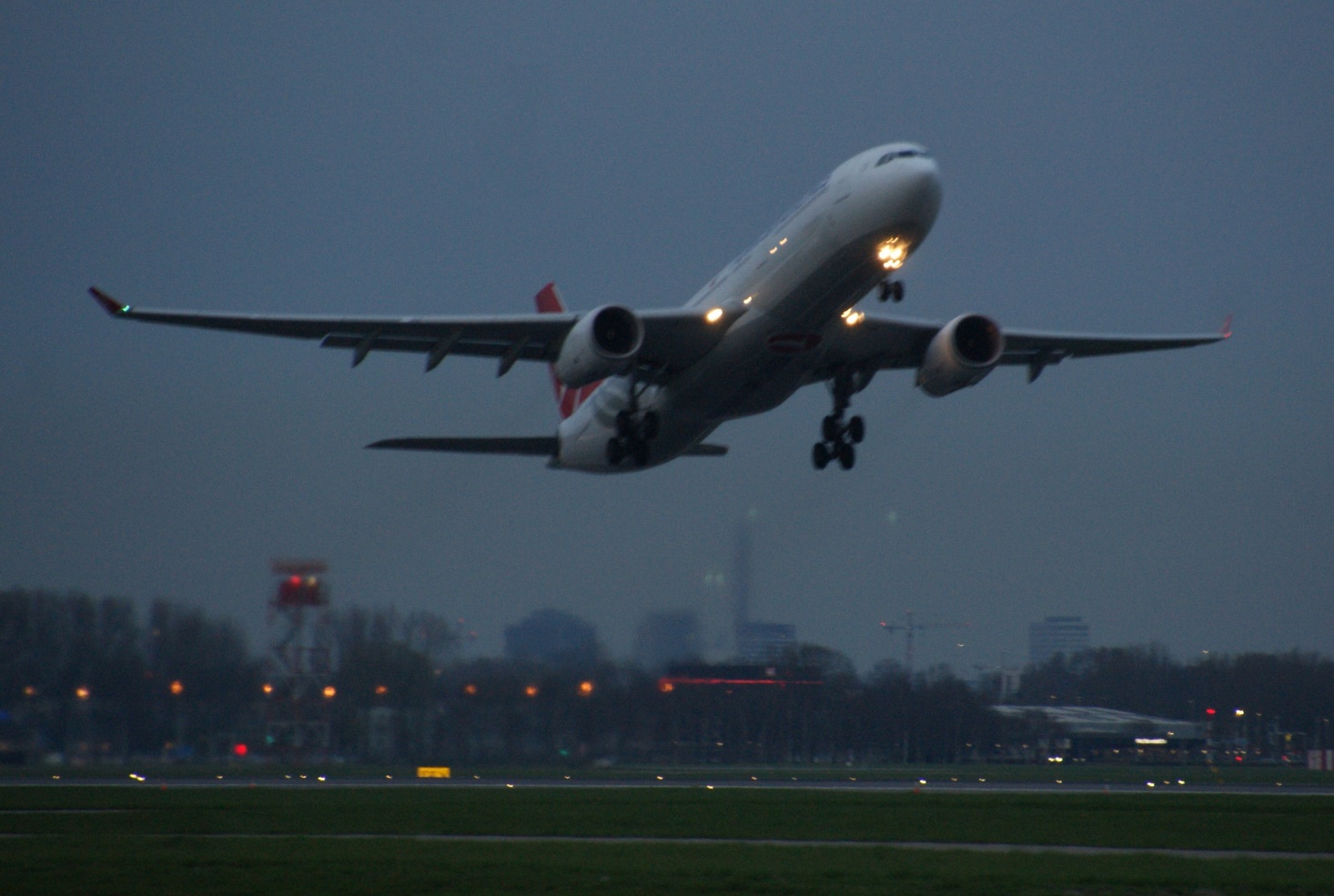 Airbus A330-300 Turkish airlines taking off from Schiphol in dusk