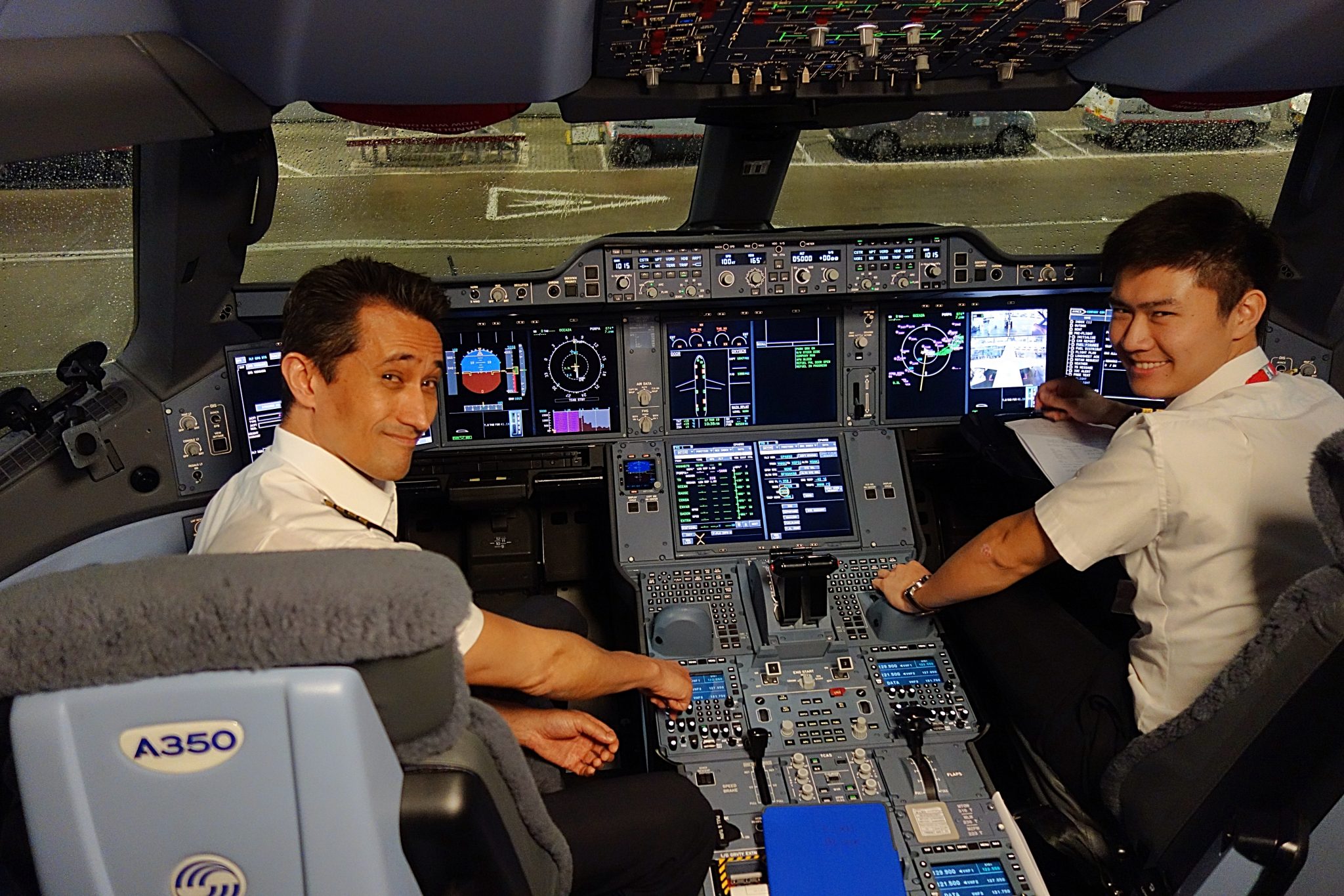 High-tech plane to Asia (Cathay Pacific's A350-1000) - Alaska Travelgram | cockpit with flight crew