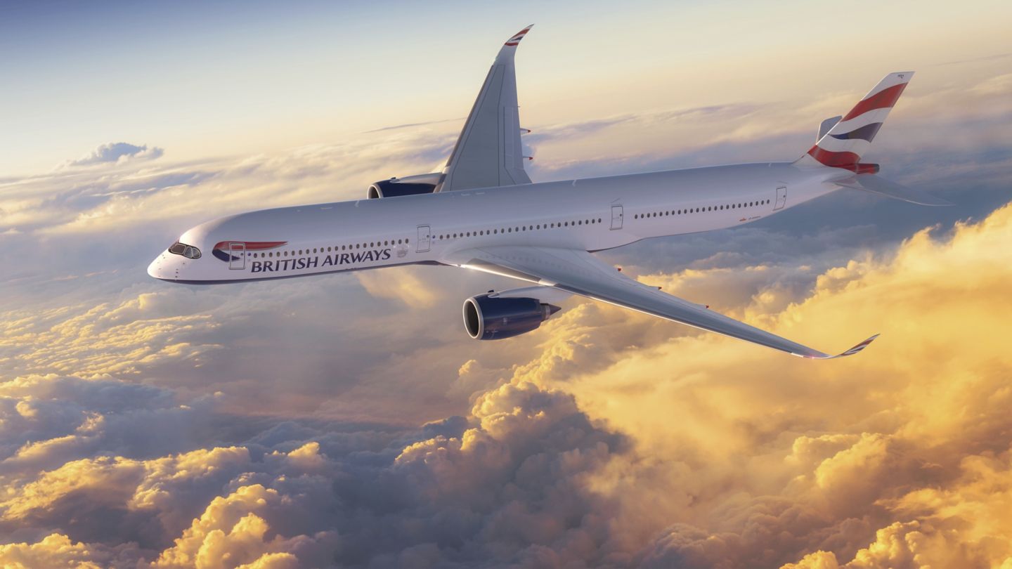 British Airways Airbus 350-1000 in flight above the golden coloured clouds.