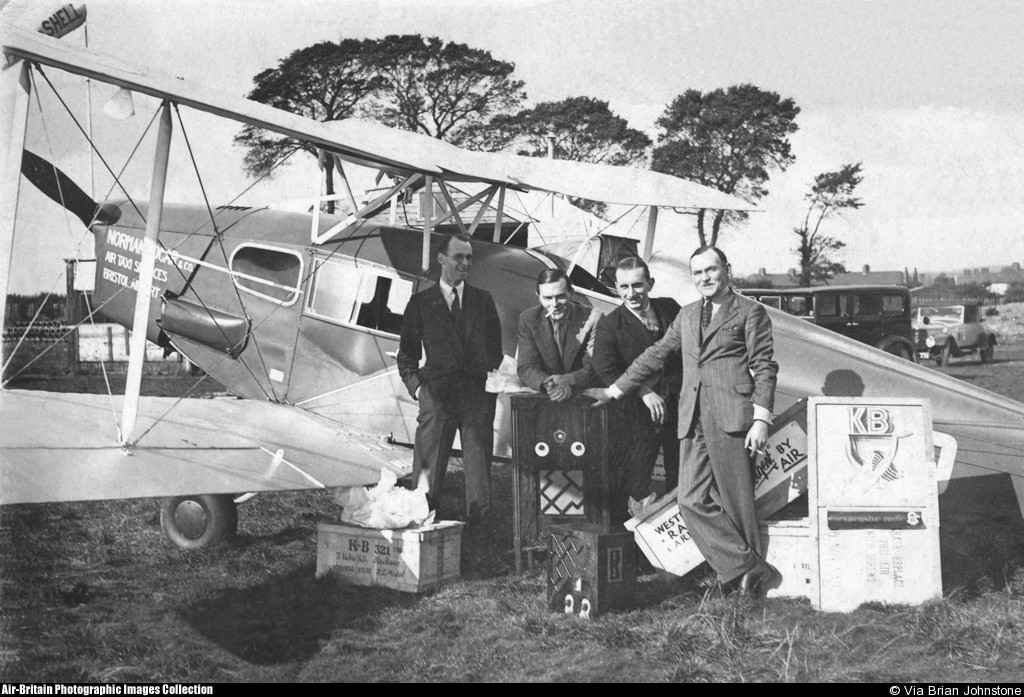 A group of people standing next to an airplane

Description automatically generated with medium confidence