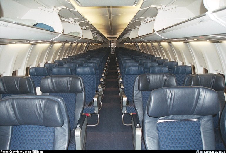 Boeing 737-800 interior with opened luggage bins