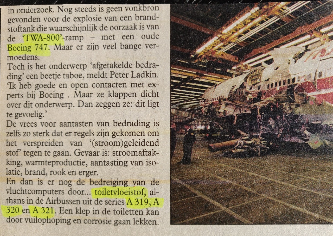 A newspaper article with a picture of a plane in a factory

Description automatically generated