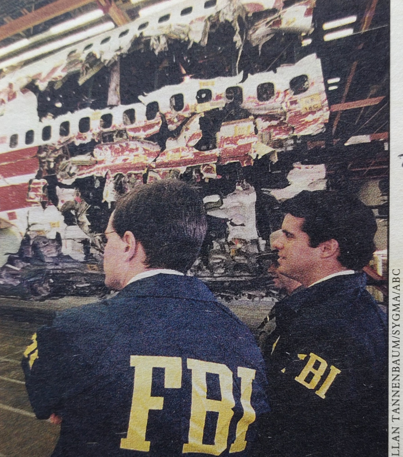 Boeing 747-100 | TWA | N93119 | FBI agents looking at the reconstructed frame of the crashed aircraft