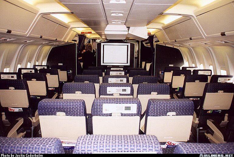 Boeing 767-200 interior with movie screen