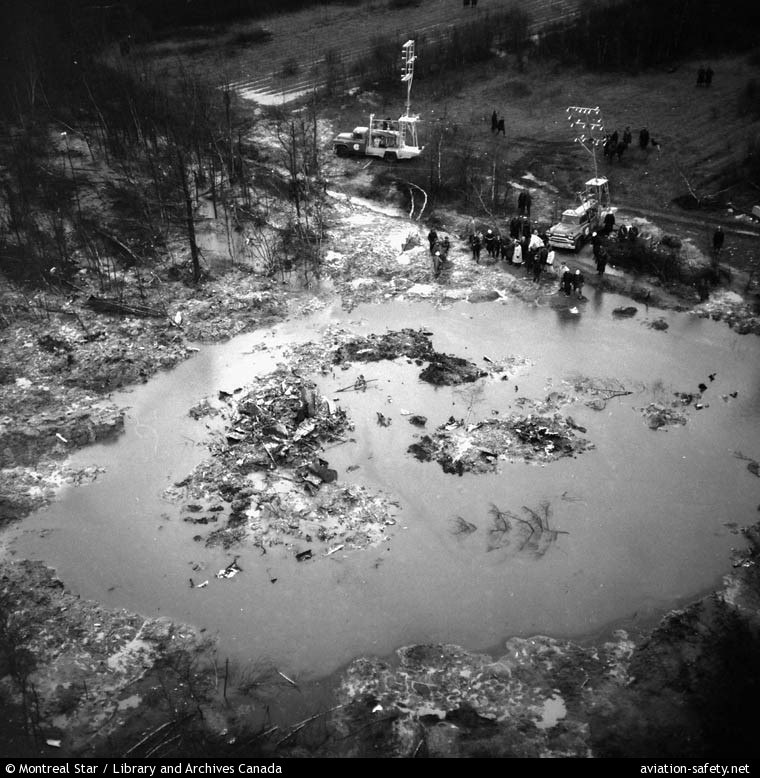 water filled crater with remains of Trans Canada Airlines Douglas DC-8-54CF CF-TJN