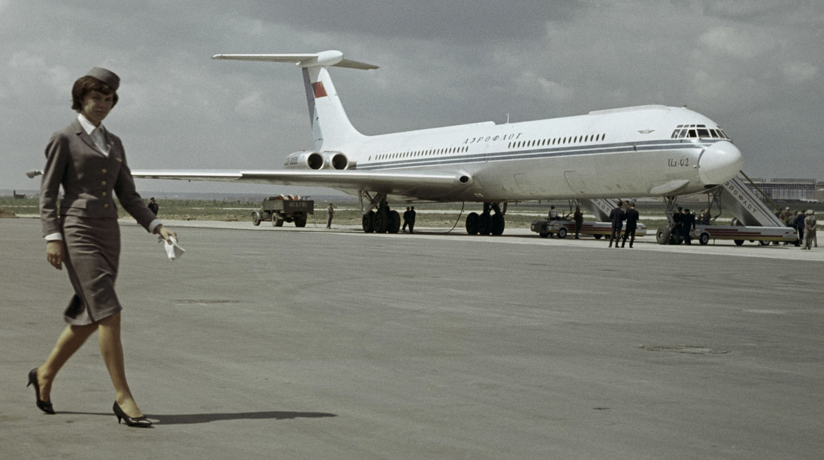 early Ilyushin Il-62 with stewardess walking in front