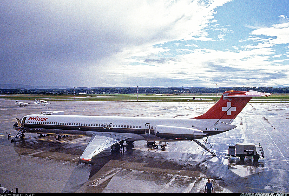 McDonnel Douglas MD-81 | Swissair | HB-INS | MD-81 parked on a wet concrete platform at Basel - Mulhouse airport