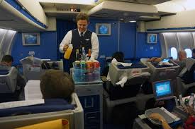 KLM McDonnell Douglas MD-11 steward serving drinks